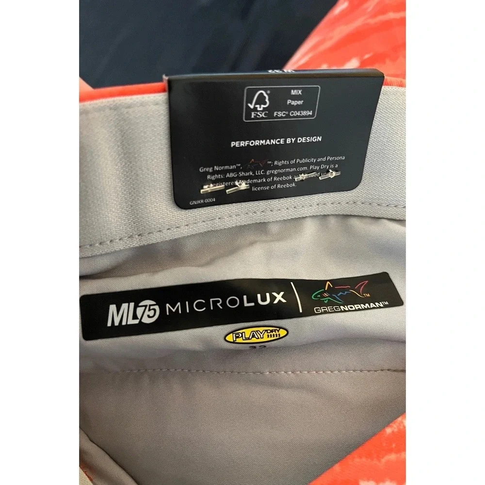 NWT Greg Norman ML75 Microlux Golf Shorts Mens 32 Coral Orange Tiger Camo Play